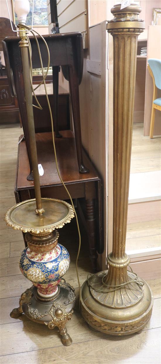 An ornate Zsolnay lamp standard and another gilt lamp standard, H.160cm & 140cm